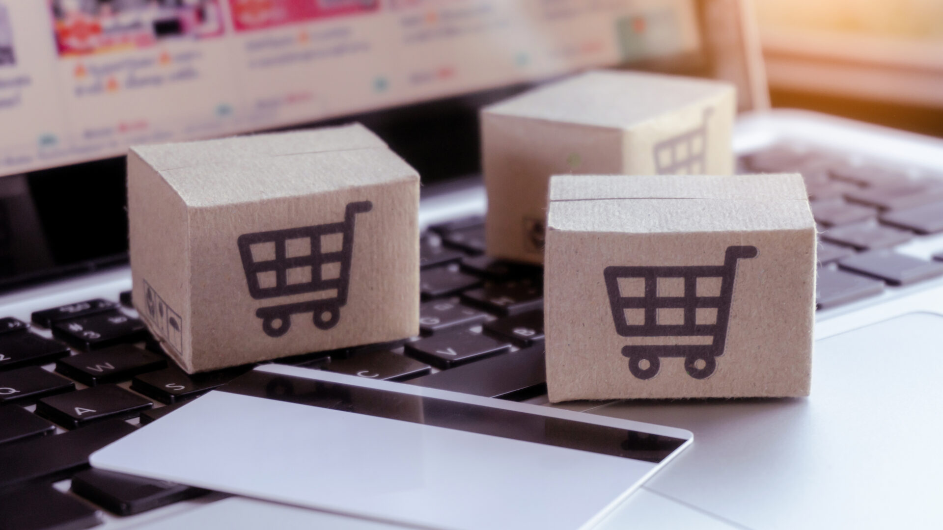 Online shopping Credit card and cardboard box with a shopping cart